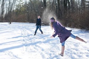 couple playing snow